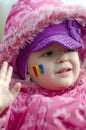 Girl with Romanian flag face-painted