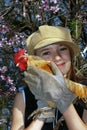 Girl with rooster Royalty Free Stock Photo