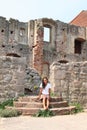 Girl in ruins of castle Pecka Royalty Free Stock Photo