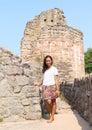 Girl in ruins of castle Pecka Royalty Free Stock Photo