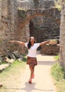 Girl in ruins of castle Pecka Royalty Free Stock Photo