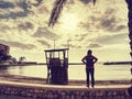 Girl runner on promenade at lifeguard tower Royalty Free Stock Photo