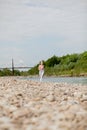 Girl runner running by riverbank . Healthy fitness woman jogging outdoors Royalty Free Stock Photo