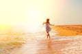 Girl running on the beach Royalty Free Stock Photo