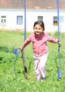 Girl running from broken swing