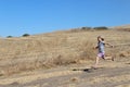 Girl Running in Dirt Field