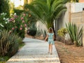 Girl running in the distance on a park path Royalty Free Stock Photo