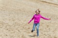 Girl running down a sand dune Royalty Free Stock Photo