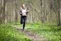 Girl running in forest