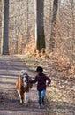 Girl running with a horse/pony