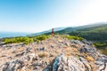 A girl is running in the mountains. A woman goes in for sports in nature. Royalty Free Stock Photo