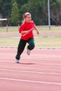 Girl running in sports race Royalty Free Stock Photo