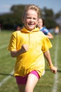 Girl running in sports race Royalty Free Stock Photo