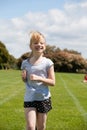 Girl running in sports race. Royalty Free Stock Photo