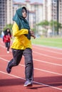 Girl running on track