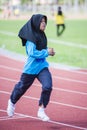 Girl running on track