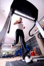 Girl running on the treadmill in the gym Royalty Free Stock Photo