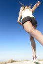 Girl running under the blue sky Royalty Free Stock Photo