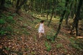 Girl running in the woods Royalty Free Stock Photo