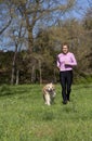 Girl running with your dog Royalty Free Stock Photo