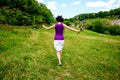 The girl runs across the field Royalty Free Stock Photo