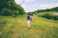 The girl runs across the field Royalty Free Stock Photo