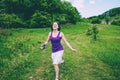 The girl runs across the field Royalty Free Stock Photo