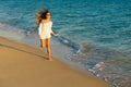 Girl runs along the seashore Royalty Free Stock Photo