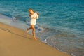 Girl runs along the seashore