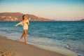 Girl runs along the surf line Royalty Free Stock Photo