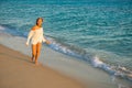 Girl runs along the surf line Royalty Free Stock Photo