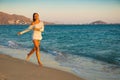 Girl runs along the surf line Royalty Free Stock Photo