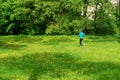 Girl runs along the trail, summer sunny day.