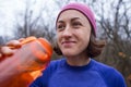 Girl drinks water after jogging Royalty Free Stock Photo