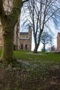 A girl runs in the distance playing in the yard of Durham Cathetral, UK Royalty Free Stock Photo