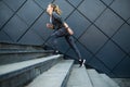 Fitness sport runs fast on a modern stair urban scene