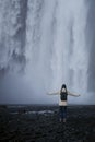 Girl runs to the skogafoss waterfall Royalty Free Stock Photo