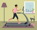 Woman running on treadmill in headphones at home