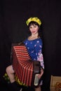 Girl in russian outfit with accordion Royalty Free Stock Photo