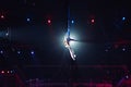 Girl`s aerial acrobatics in the Circus arena. Royalty Free Stock Photo