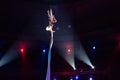 Girl`s aerial acrobatics in the Circus ring. Royalty Free Stock Photo