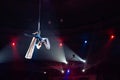 Girl`s aerial acrobatics in the Circus ring. Royalty Free Stock Photo