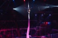 Girl`s aerial acrobatics in the Circus ring. Royalty Free Stock Photo