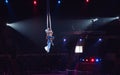 Girl`s aerial acrobatics in the Circus ring.