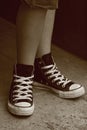 Girl's feet in converse sneakers