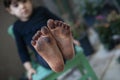 Girl\'s feet dirty with dirt
