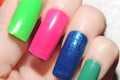 The multicolored false nails.