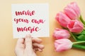 Girl`s hand holding card with inspirational quote Royalty Free Stock Photo