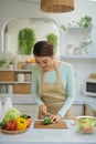 Girl`s hands cutting vegetables on cutting board Royalty Free Stock Photo