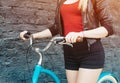 Girl's hands on the handlebars of the vintage bicycle close up, Filter, light leak effect. Royalty Free Stock Photo